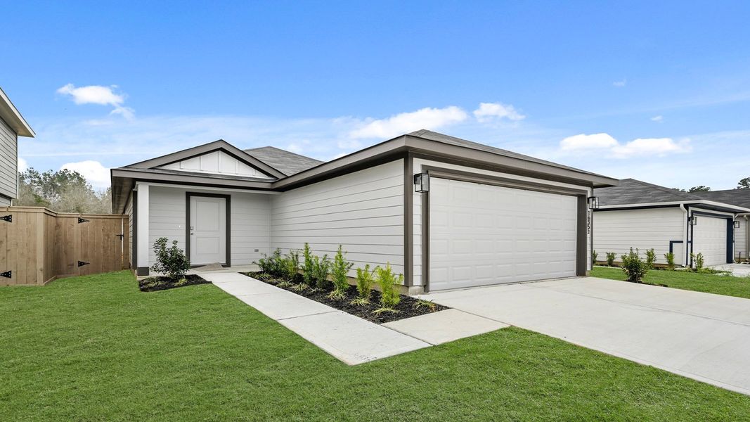 Front exterior of a new home in The Canopies, Splendora, TX, highlighting curb appeal (Image 15).
