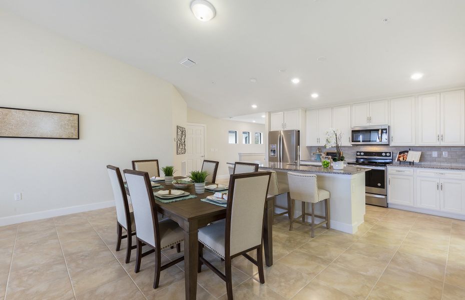 Café dining space ideally located off of kitchen and gathering room