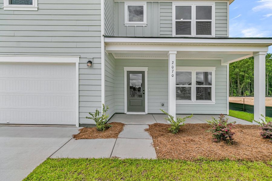 Exterior details and patio area of a home in , Ravenel (Image 3). Exterior details and patio area of a home in , Ravenel (Image 3).