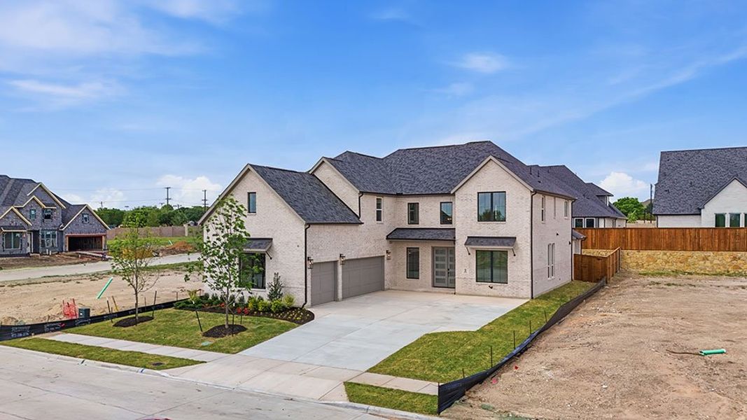 Front exterior of a new home in Custer Ridge Estates, Allen, TX, highlighting curb appeal (Image 27).