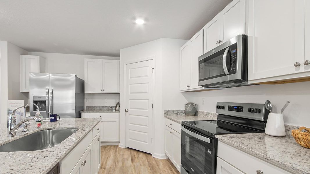 Furnished interior view inside a new home in Ashton Park Phase III, Freeport (Image 10).