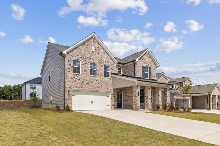 A large house with a driveway. A large house with a driveway.