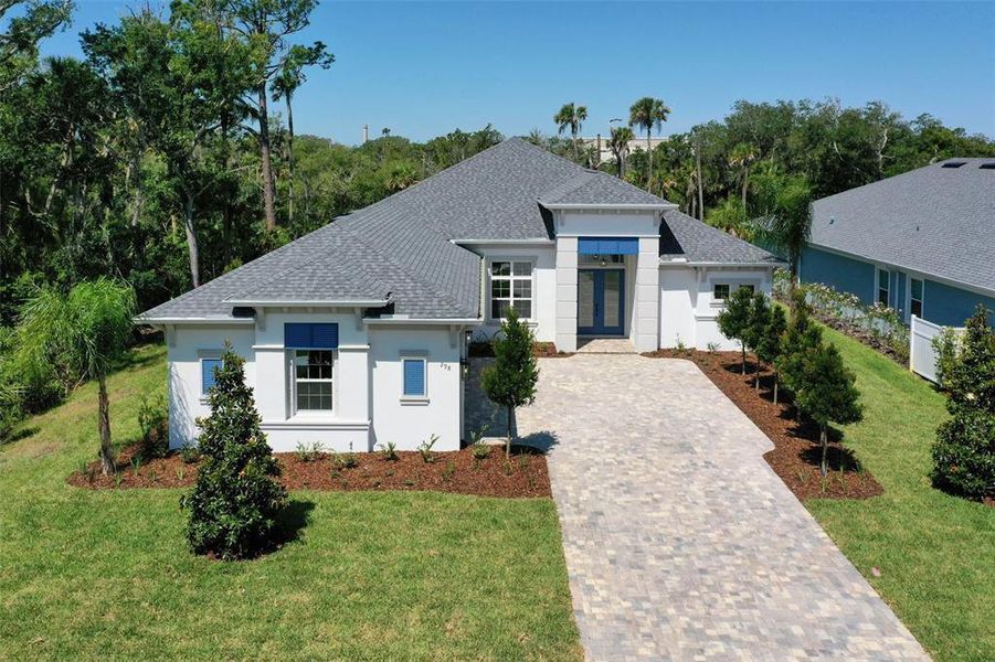 Front exterior of a new home in , Palm Coast, FL, highlighting curb appeal (Image 29). Front exterior of a new home in , Palm Coast, FL, highlighting curb appeal (Image 29).