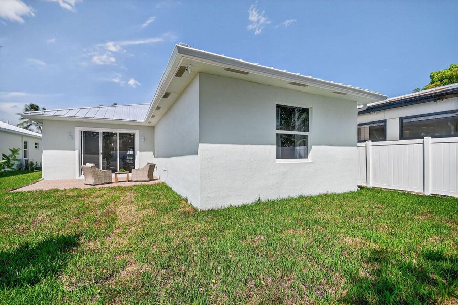 Front exterior of a new home in , Jupiter, FL, highlighting curb appeal (Image 1).