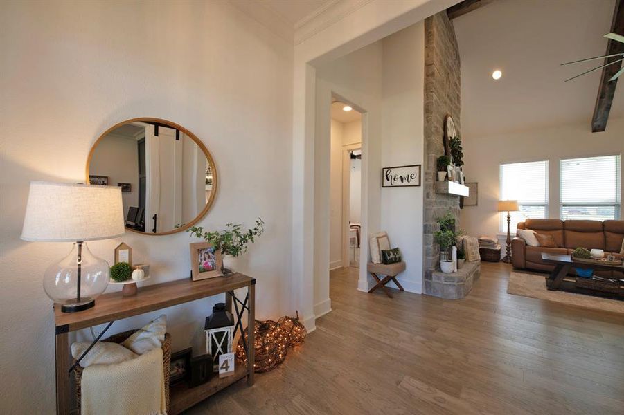 Hall featuring wood finished floors and recessed lighting