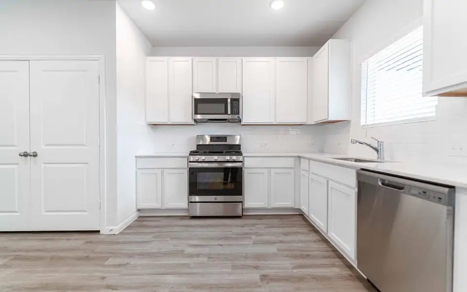 Furnished interior view inside a new home in The Pines at Seven Coves, Willis (Image 4).