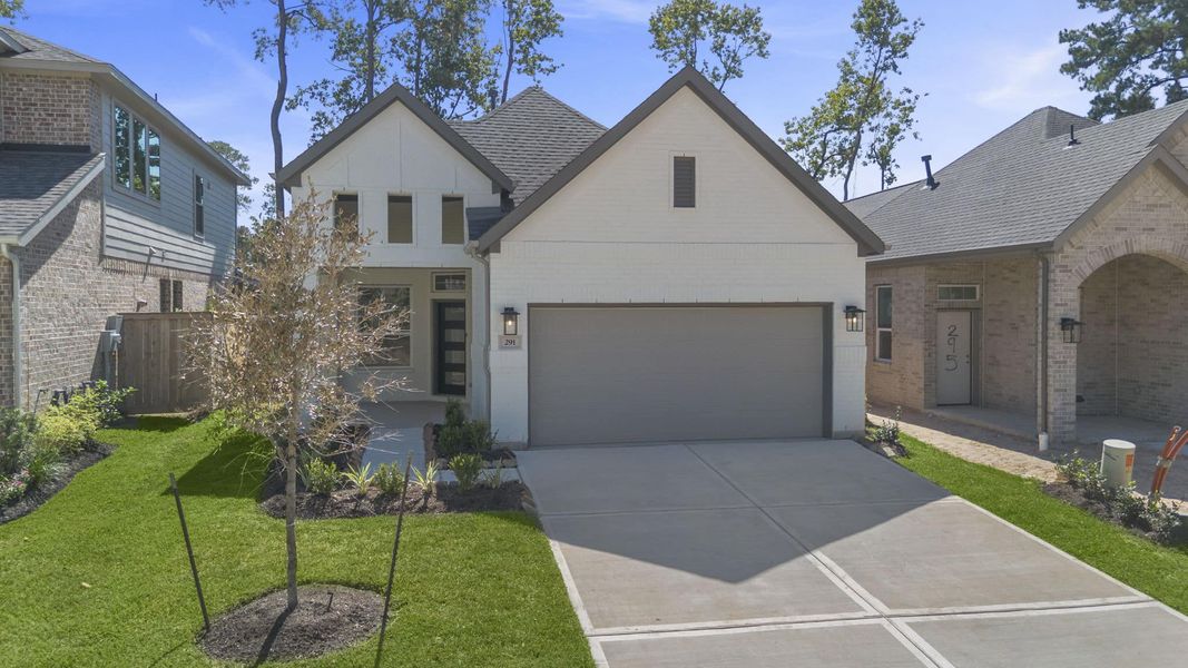Front exterior of a new home in The Woodlands Hills, Willis, TX, highlighting curb appeal (Image 20). Front exterior of a new home in The Woodlands Hills, Willis, TX, highlighting curb appeal (Image 20).