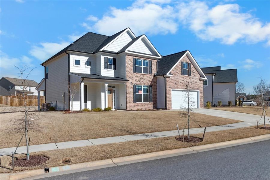 Front exterior of a new home in Tillery Park, Grovetown, GA, highlighting curb appeal (Image 27). Front exterior of a new home in Tillery Park, Grovetown, GA, highlighting curb appeal (Image 27).