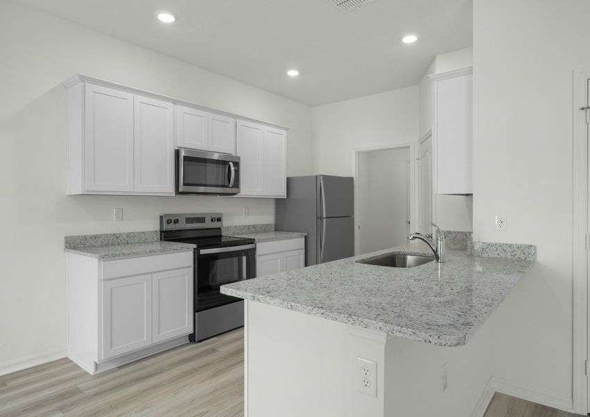 Chef-ready kitchen with granite countertops and white cabinets Chef-ready kitchen with granite countertops and white cabinets