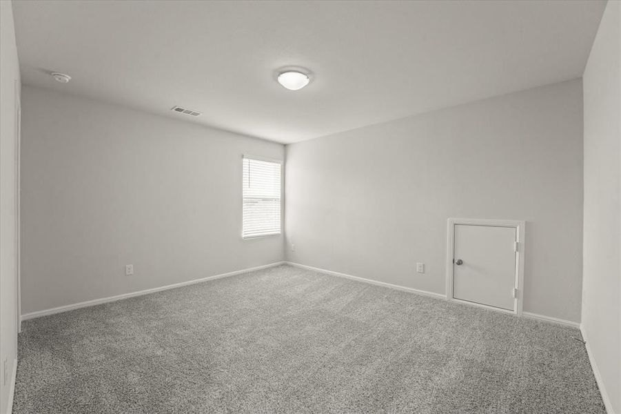 Empty room with carpet floors