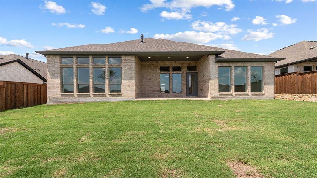 Front exterior of a new home in Reunion 60'/70', Rhome, TX, highlighting curb appeal (Image 2). Front exterior of a new home in Reunion 60'/70', Rhome, TX, highlighting curb appeal (Image 2).