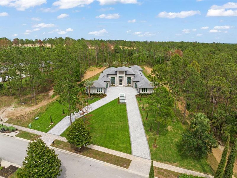 Front exterior of a new home in , Montverde, FL, highlighting curb appeal (Image 2).