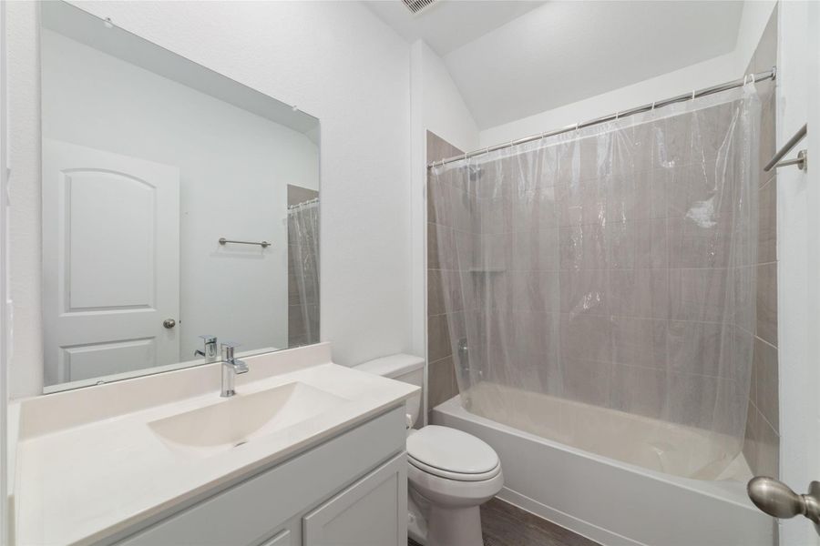 Furnished interior view inside a new home in Sunterra, Katy (Image 9).