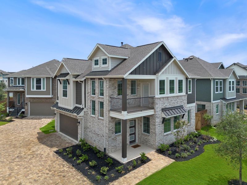 Front exterior of a new home in Elyson, Katy, TX, highlighting curb appeal (Image 6).