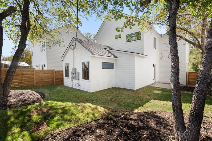 Rear view of property with a shingled roof Rear view of property with a shingled roof