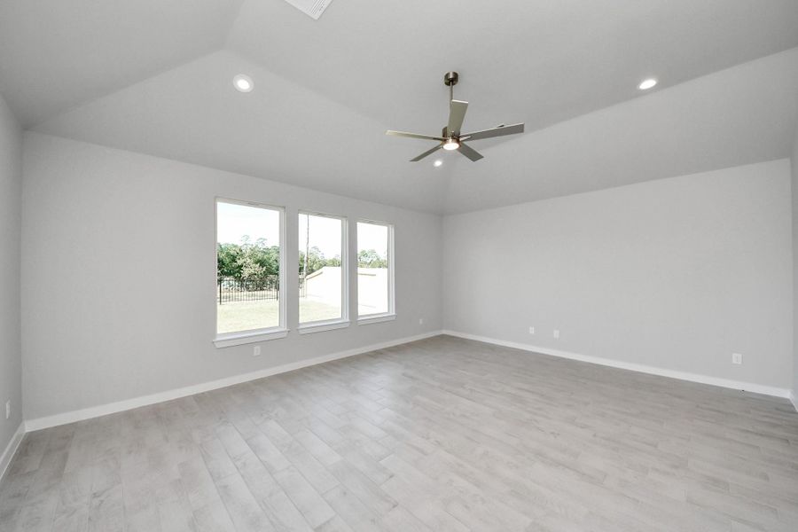 Take another glimpse into the heart of the home with this additional view of the family room—a sprawling space ready to accommodate all your gatherings. Sample photo of completed home with similar floor plan. Actual colors and selections may vary.