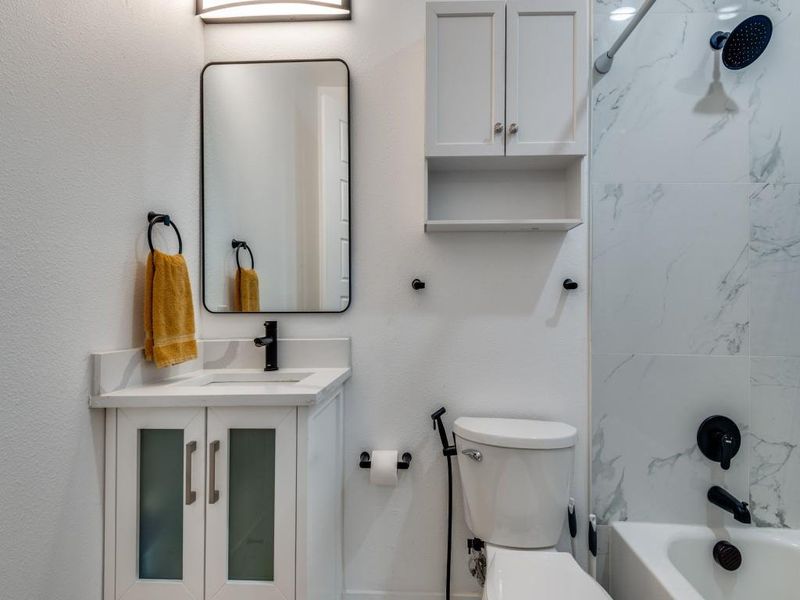 Full bathroom featuring vanity and shower / washtub combination