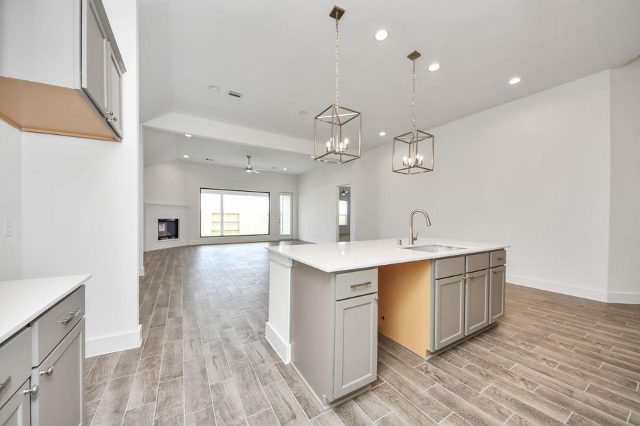 All of this overlooks your expansive family room, creating a perfect space for culinary delights and family gatherings.
