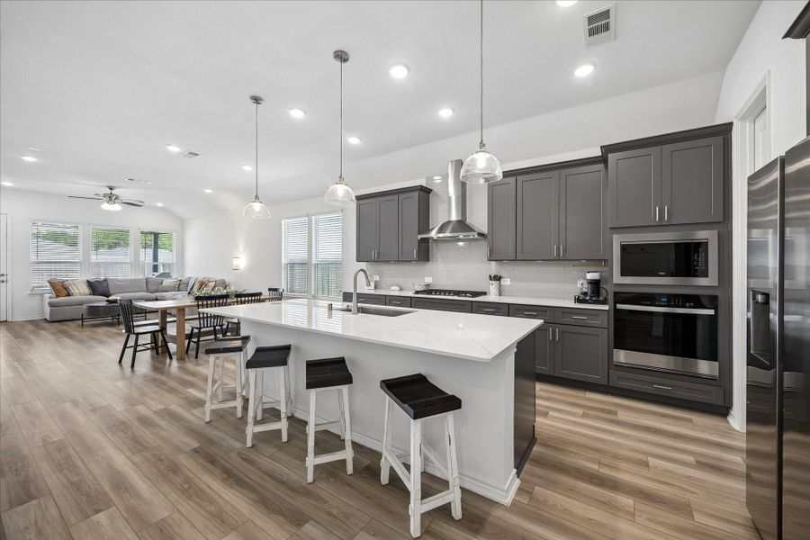 Chef-inspired kitchen featuring a large island, gas cooking, and abundant storage.