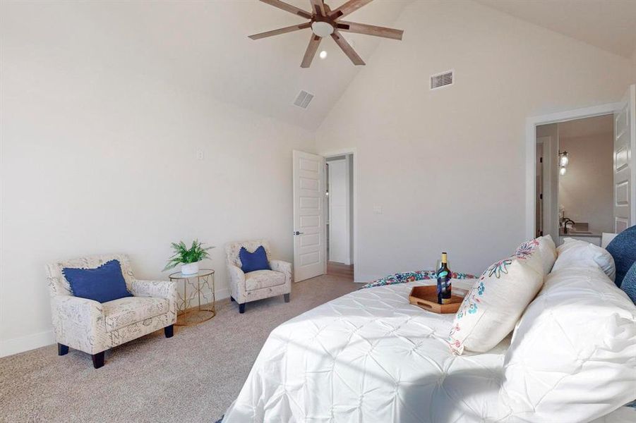 Bedroom featuring high vaulted ceiling, carpet, and ceiling fan