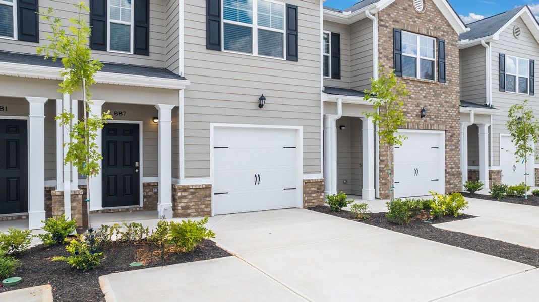 Front exterior of a new home in The Parish at Flat Rock Townhomes, Graniteville, SC, highlighting curb appeal (Image 19). Front exterior of a new home in The Parish at Flat Rock Townhomes, Graniteville, SC, highlighting curb appeal (Image 19).