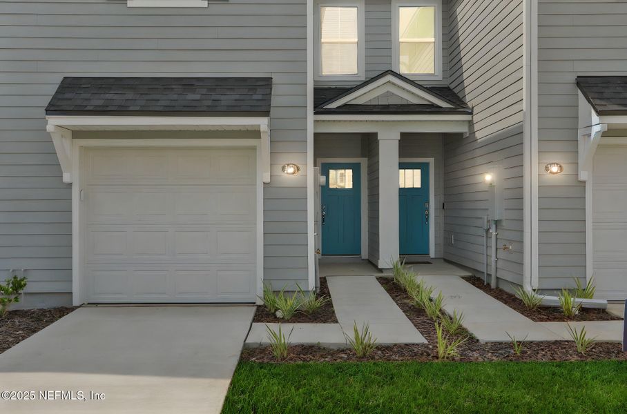 Front exterior of a new home in Atlantis Pointe, Middleburg, FL, highlighting curb appeal (Image 23).