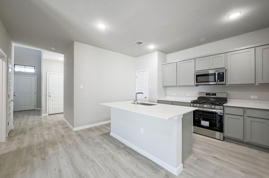 Kitchen in the Willow home plan by Trophy Signature Homes – REPRESENTATIVE PHOTO