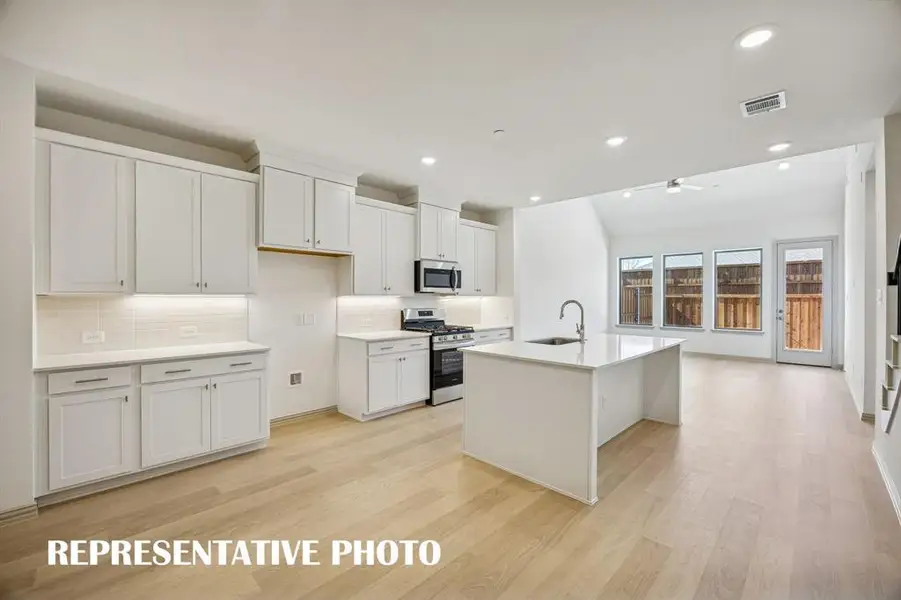 You'll enjoy outstanding storage and prep space in this dream kitchen!  REPRESENTATIVE PHOTO