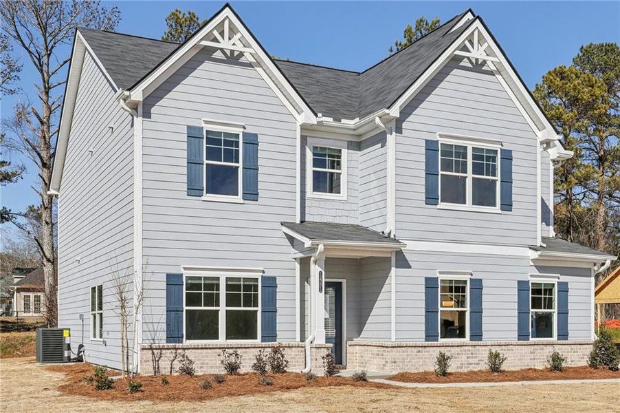 Front exterior of a new home in Stephen's Landing, Loganville, GA, highlighting curb appeal (Image 1).