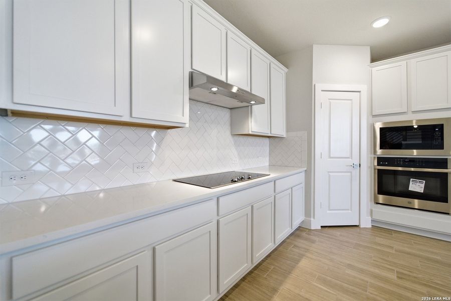 Furnished interior view inside a new home in The Woodlands at Medina Hills, Mico (Image 6).