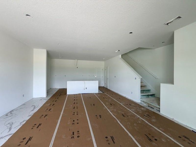 In-progress construction of a new home in Whaley Grove Townhomes, St. Cloud, FL (Image 9).