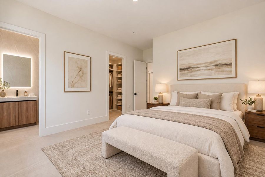 Elegant bedroom staging with warm lighti