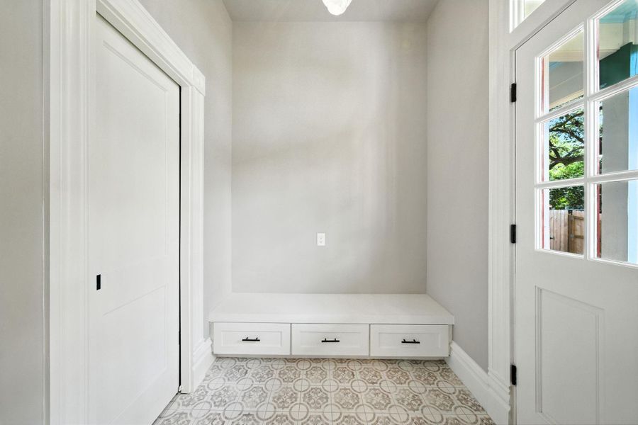Just a quick peek into the mudroom. Door (closed) on the left is the half bath. Rear entry door on the right, making it easy to enter/exit to the carport / backyard Just a quick peek into the mudroom. Door (closed) on the left is the half bath. Rear entry door on the right, making it easy to enter/exit to the carport / backyard