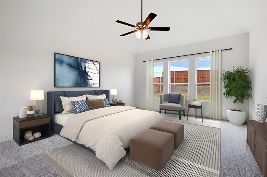 Carpeted bedroom featuring ceiling fan and high vaulted ceiling