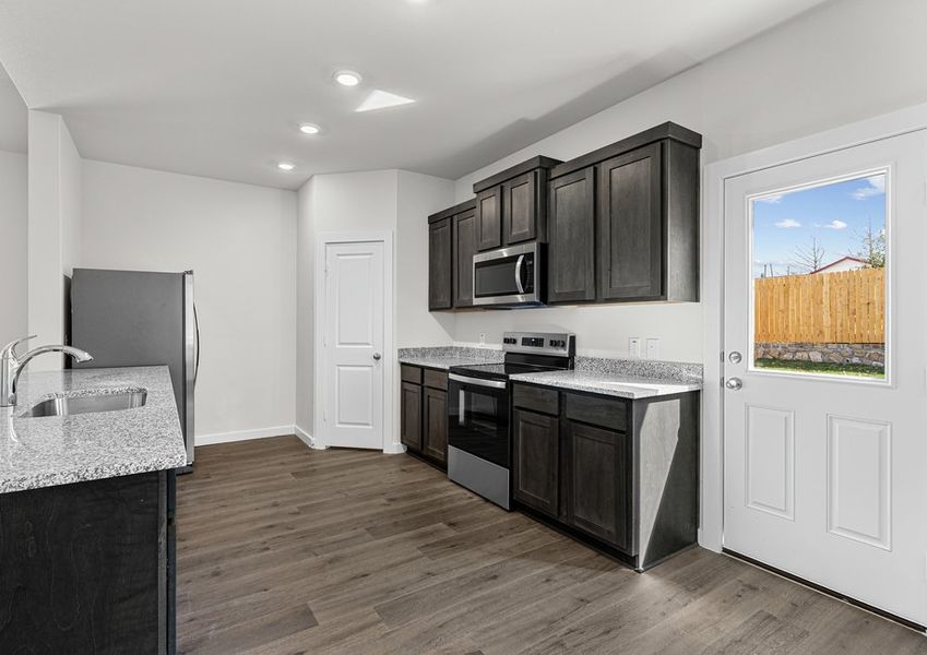 The kitchen has a wonderful breakfast bar.