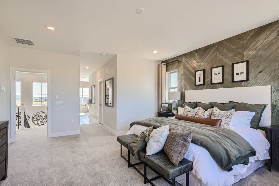 A bedroom with a bed and a couch. A bedroom with a bed and a couch.