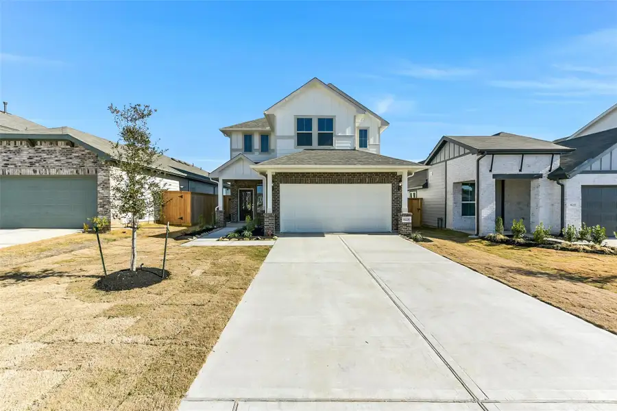 Front exterior of a new home in Colony at Pinehurst, Pinehurst, TX, highlighting curb appeal (Image 2). Front exterior of a new home in Colony at Pinehurst, Pinehurst, TX, highlighting curb appeal (Image 2).