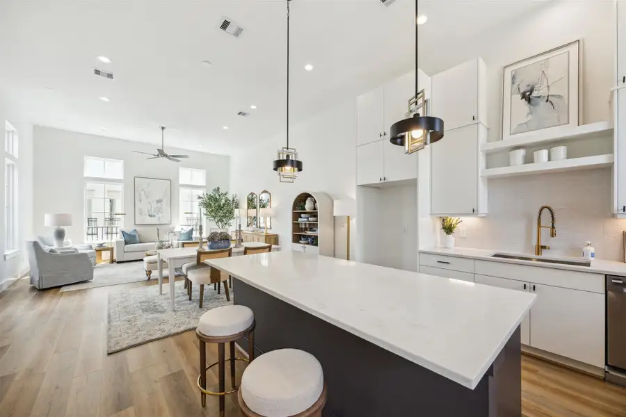 Here is a view of your beautiful kitchen toward your dining and living area. This open floor plan brings in lots of light.. Here is a view of your beautiful kitchen toward your dining and living area. This open floor plan brings in lots of light..