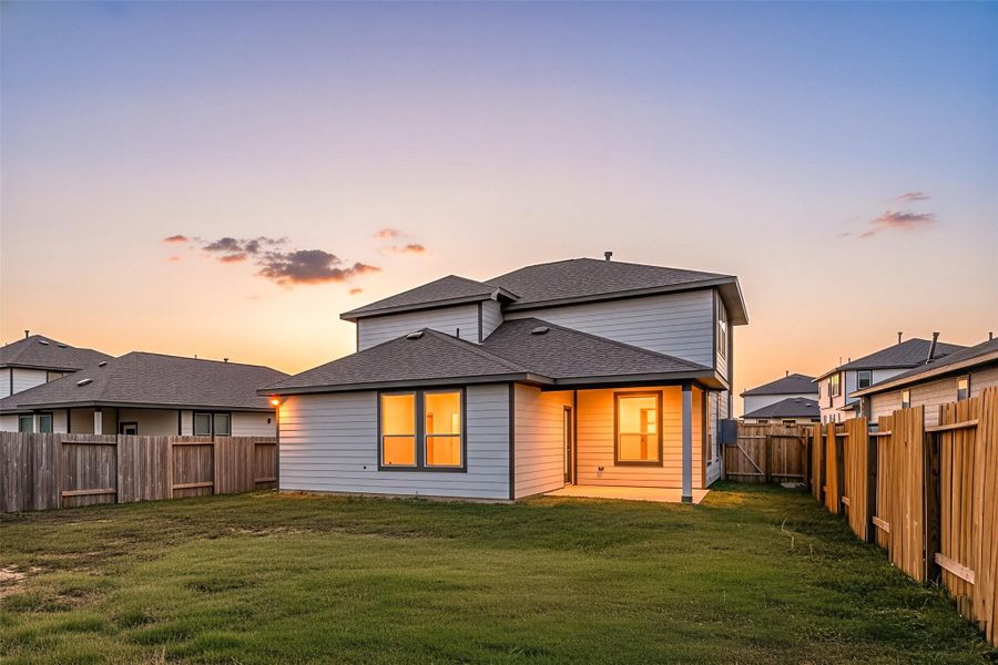A spacious backyard with a covered patio, offering plenty of room for outdoor activities or future enhancements. The fenced-in yard provides privacy and a safe space to enjoy quiet evenings or host casual gatherings while taking in the warm glow of sunset views. A spacious backyard with a covered patio, offering plenty of room for outdoor activities or future enhancements. The fenced-in yard provides privacy and a safe space to enjoy quiet evenings or host casual gatherings while taking in the warm glow of sunset views.