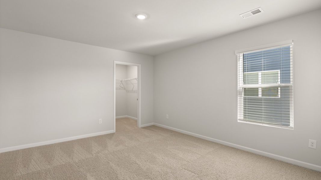 Representative unfurnished interior of a home built from the Mansfield by D.R. Horton in Southwind Village, Evans (Image 30).
