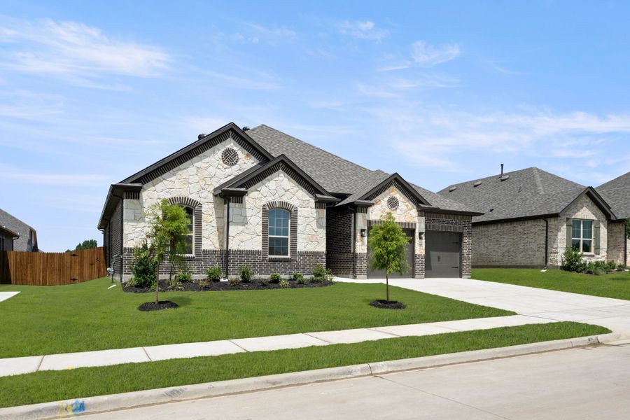 Front exterior of a new home in Sheppard's Place, Waxahachie, TX, highlighting curb appeal (Image 22). Front exterior of a new home in Sheppard's Place, Waxahachie, TX, highlighting curb appeal (Image 22).