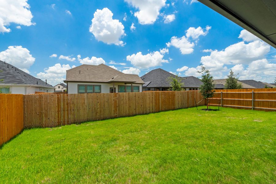 Exterior details and patio area of a home in Prairie Winds, Hutto (Image 24).