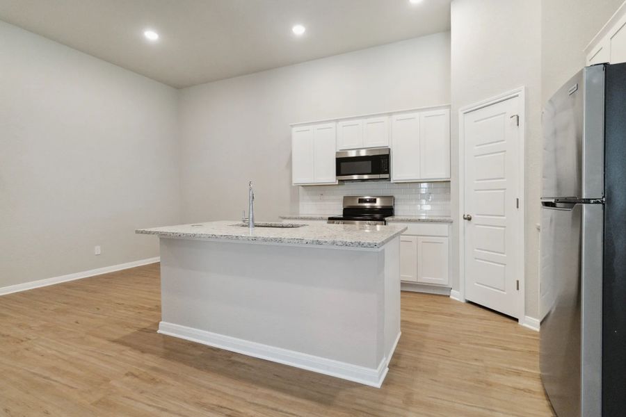 Representative furnished interior of a home built from the Duplex 1299 by TwoTen Communities in Emma Park, Buda (Image 12). Representative furnished interior of a home built from the Duplex 1299 by TwoTen Communities in Emma Park, Buda (Image 12).