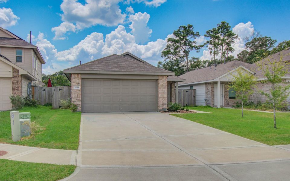 Front exterior of a new home in Tavola: Cottage Collection, New Caney, TX, highlighting curb appeal (Image 19).