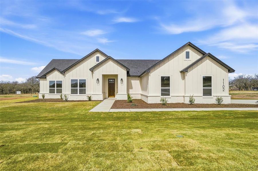 Front exterior of a new home in Taylor Ranch, Springtown, TX, highlighting curb appeal (Image 20).