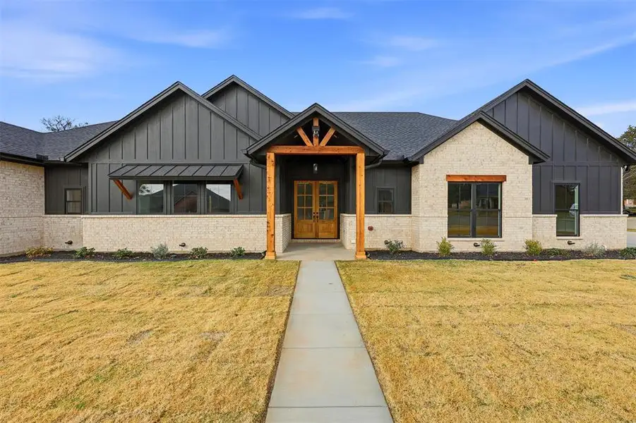 Front exterior of a new home in , Grandview, TX, highlighting curb appeal (Image 1). Front exterior of a new home in , Grandview, TX, highlighting curb appeal (Image 1).
