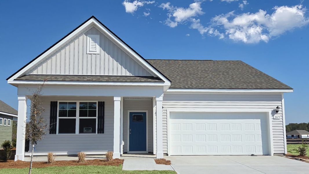 Front exterior of a new home in Pinewood Estates, Conway, SC, highlighting curb appeal (Image 2). Front exterior of a new home in Pinewood Estates, Conway, SC, highlighting curb appeal (Image 2).