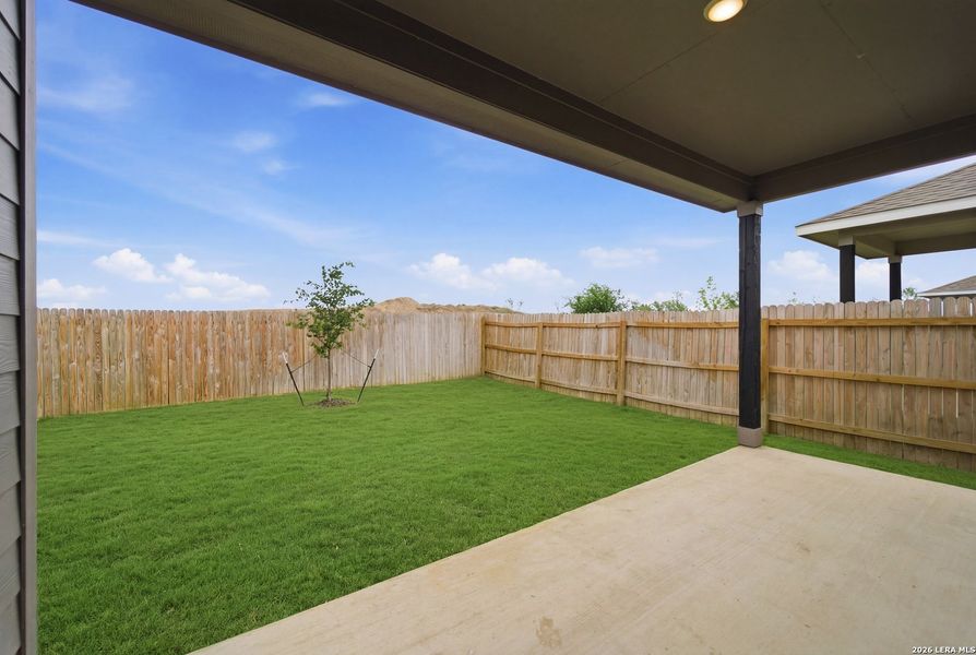 Exterior details and patio area of a home in Hennersby Hollow, San Antonio (Image 17).