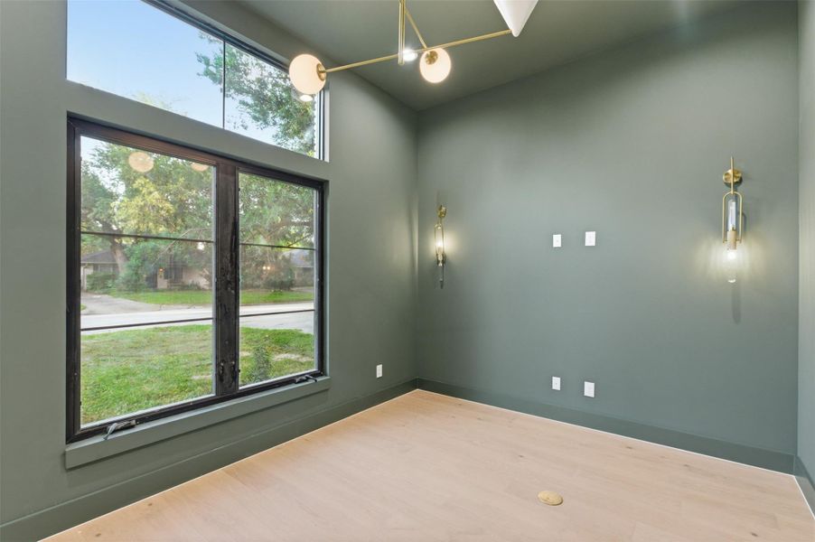 Create your perfect work-from-home setup in this sophisticated study filled with natural light and modern elegance.