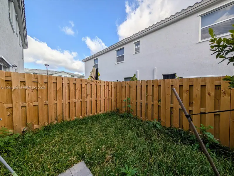 Exterior details and patio area of a home in , Florida City (Image 3).